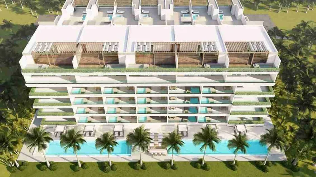 Modern two bedroom condo for sale in Punta Cana with a jacuzzi and pool views. 10 1