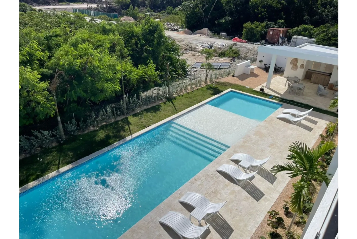 Residencias Palmeira: Apartamento de 2 dormitorios con vistas a la piscina en venta en Ciudad Las Canas, Cap Cana