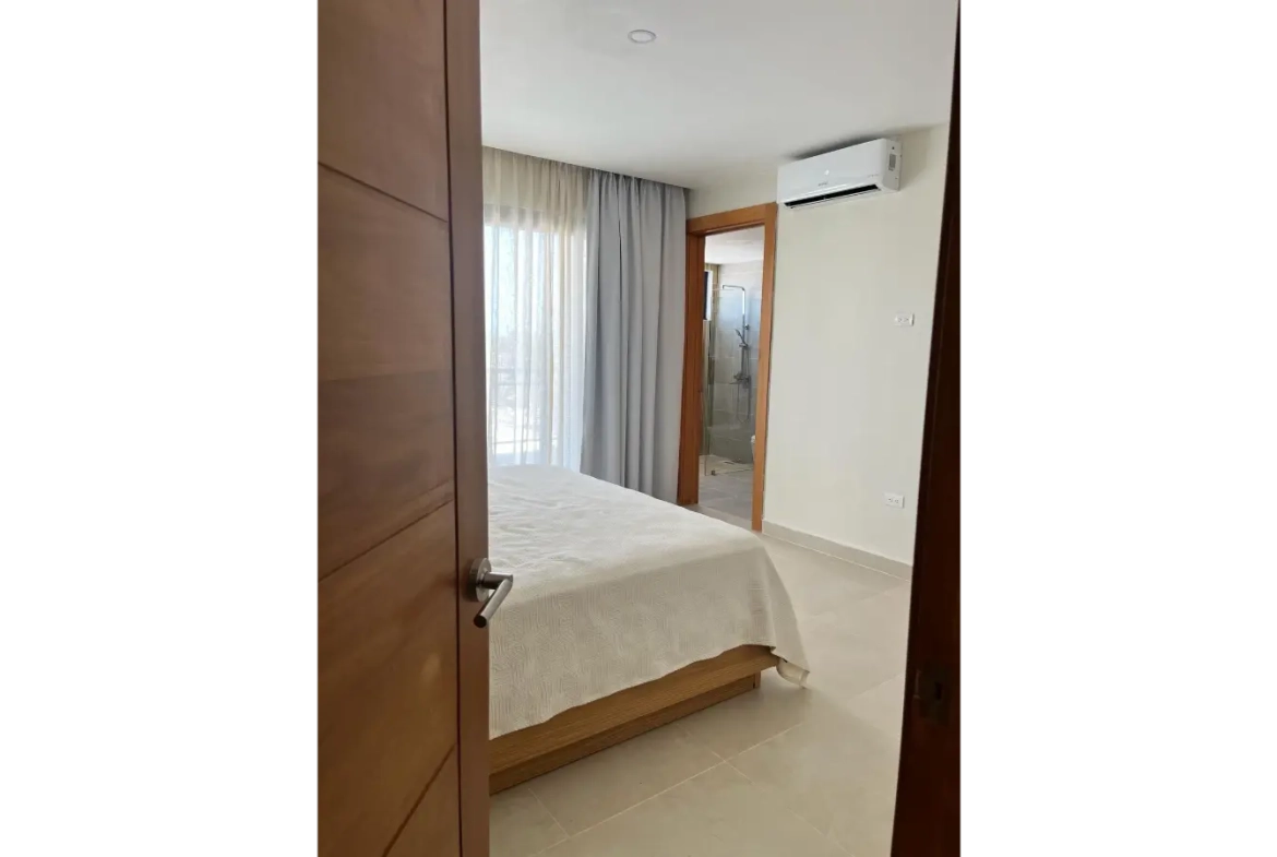 Residencias Palmeira: Apartamento de 2 dormitorios con vistas a la piscina en venta en Ciudad Las Canas, Cap Cana