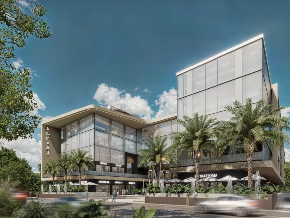 Vista exterior del edificio de oficinas Social Business Center en el centro de Punta Cana con fachada moderna y acceso desde la calle.